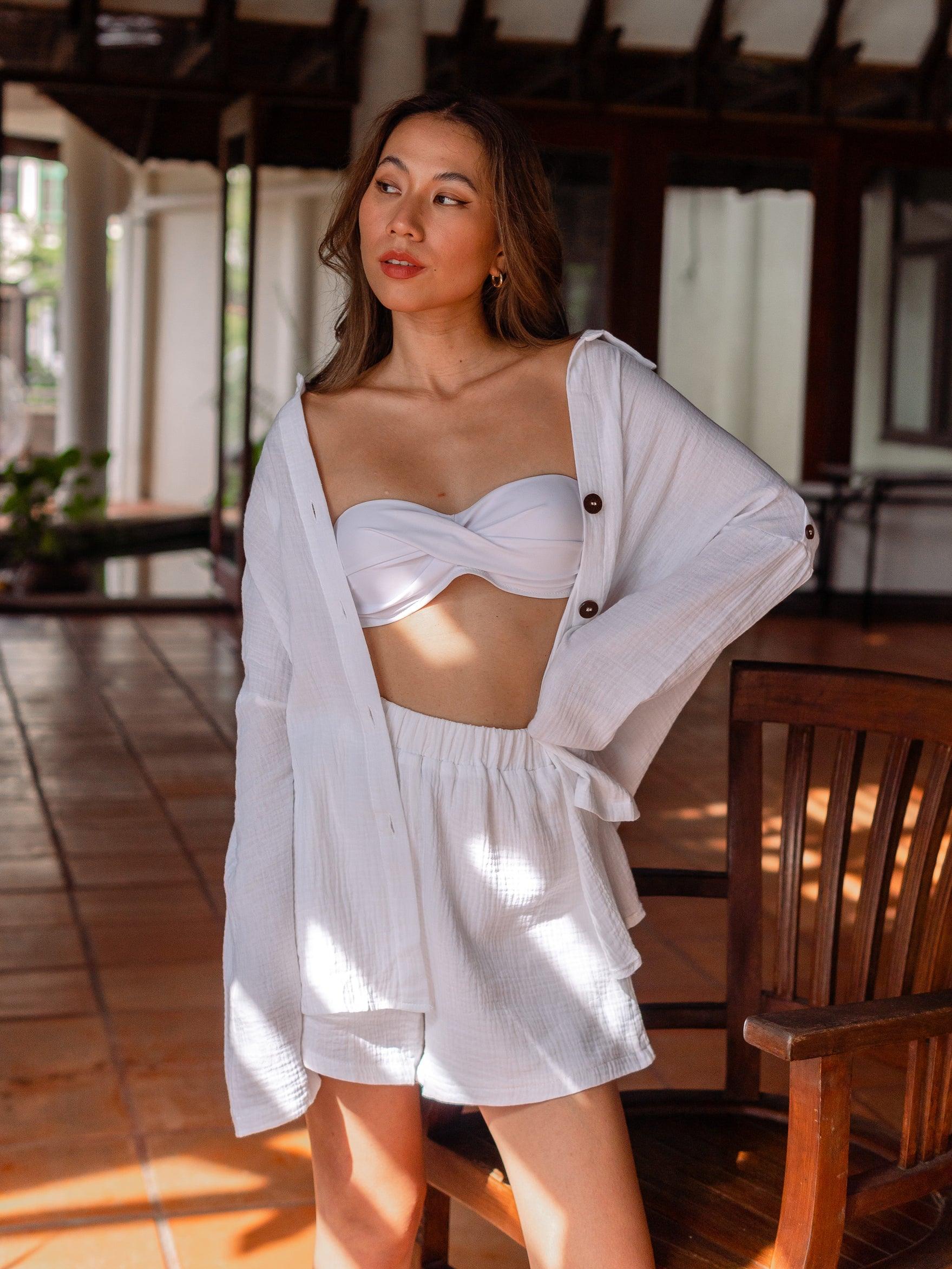Colourful bikini styled with an oversized white shirt