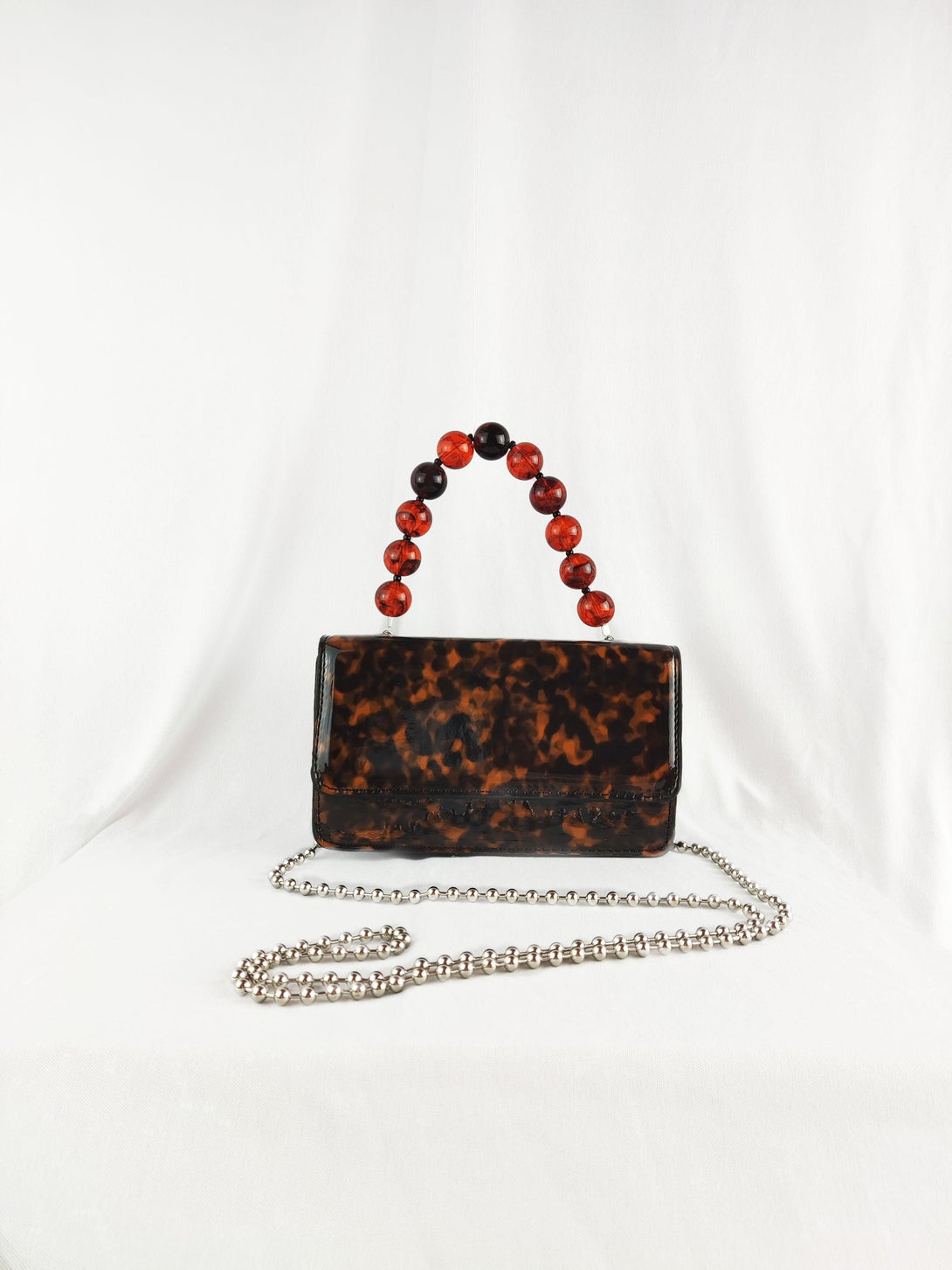 Camilla Tortoiseshell Crossbody Front Lapel Magnetic Clasp Handbag With Brown Beaded Acrylic Top Handle in Brown - Pink N' Proper