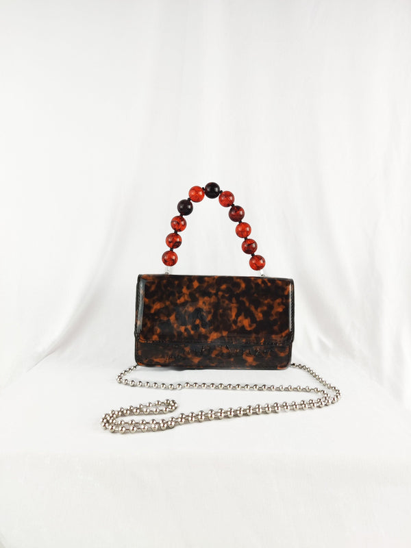 Camilla Tortoiseshell Crossbody Front Lapel Magnetic Clasp Handbag With Brown Beaded Acrylic Top Handle in Brown - Pink N' Proper